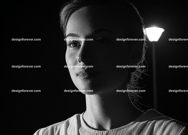 gargoyles in front of woman's home at night shown by street lamp